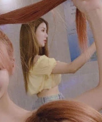 29) when Eunbi wore a yellow crop top on vacation while everyone else wore white...and we never got a good front view of this outfit,,