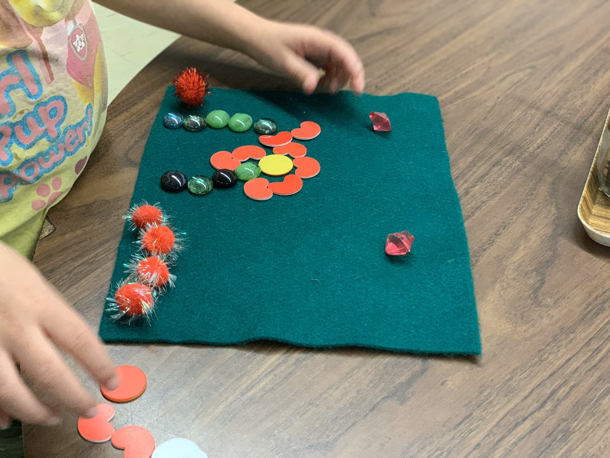 Using Loose parts to make a field of poppies.