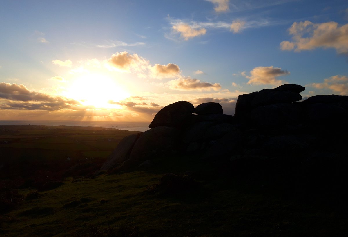 Chapel Carn Brea Long Cairn is a natural granite outcrop that was extended by 11m by our Neolithic ancestors. Panoramic views to The Scillies one way, The Lizard in the other. Long cairns quite rare in these parts. It catches the evening sun beautifully. #PrehistoryOfPenwith