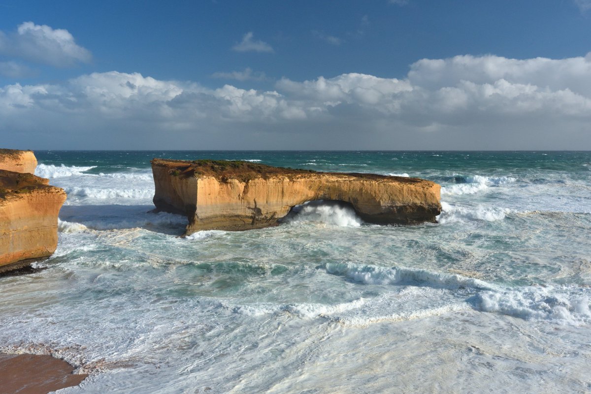 #scape366.com 314 - A wild day on the #greatoceanroad, with the #wind and #waves covering the #bassstrait in #white #foam. The #spray of a wave bursting through the #londonarch, formerly the #londonbridge, before the first #rock #span collapsed in 1990 #coastscape