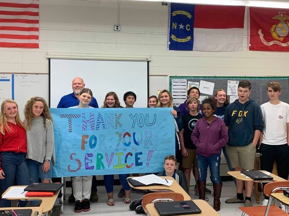 AllisonCTE's tweet photo. West Carteret students made a poster honoring their WCHS AG teacher Robert Reynolds and Veteran. Celebrating his service for Veterans Day! Semper  Fi and thanks. #CTETheHotTopic #careerready @WestCarteretCTE @lee_a_oneal @MadisonCTE @CTEforNC https://t.co/aSK0pqPXjh
