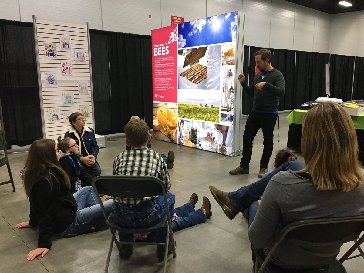 FarmfairInt's tweet photo. It’s 4H Day @Northlands #Farmfair! Here’s @DustinBajer in action; teaching @4halberta members about his passion: BEES! #HoneyBees #NativeBees #Pollinators #YEGbees #ABBees #YouthinAg #AbAg https://t.co/0DELbydO6n