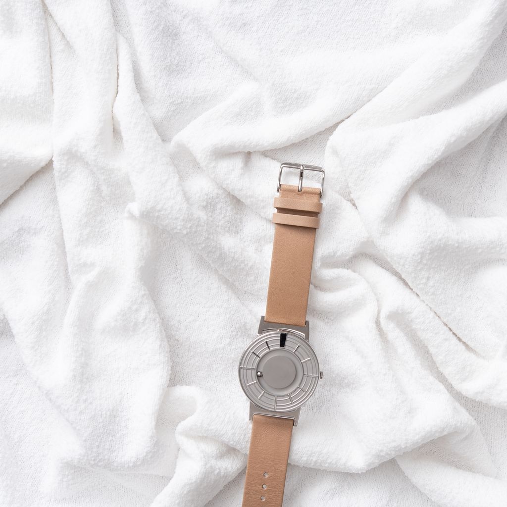 The Bradley Edge Silver is seen on a textural piece of white fabric.