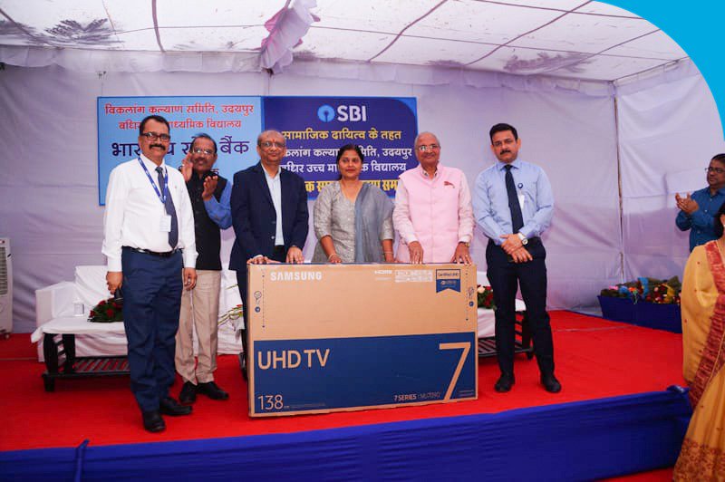 TheOfficialSBI's tweet photo. #SBICSRAcitivity #SBI MD, Shri PK Gupta was the chief guest at a special event organised at the Deaf and Dumb School Ambamata, in Udaipur. On behalf of the Bank, he presented a 55" LED TV, to the students, as well as sweaters, shoes and socks.

#StateBankofIndia #Udaipur https://t.co/W8oR3pfAqA