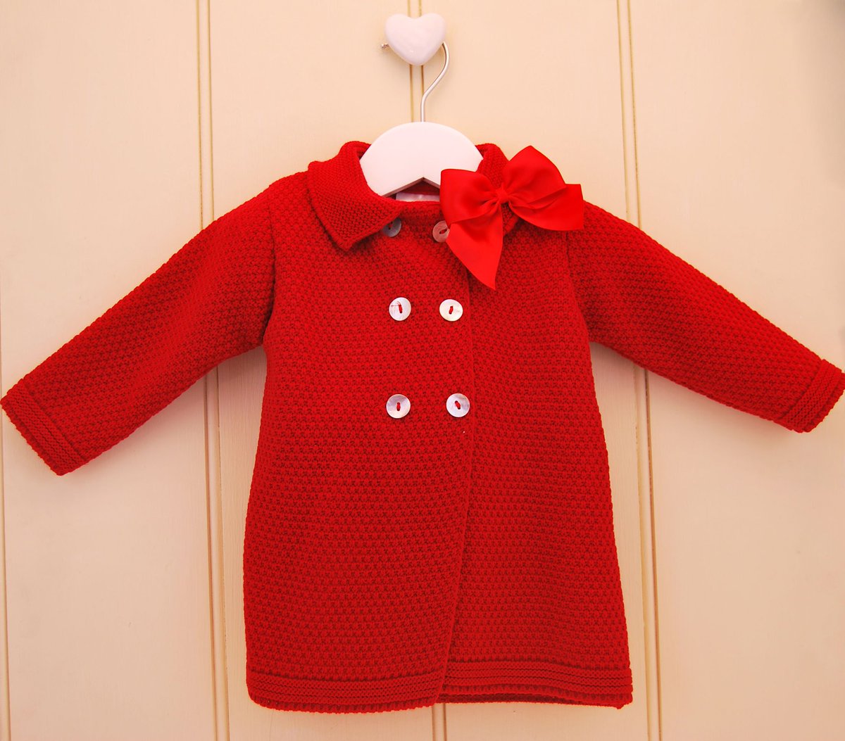 PEXwholesale's tweet photo. Jeanie coats are the perfect way to keep little bods cosy this festive season.  Traditional knitted design with a stunning bow and smart mother of pearl buttons.  
#babyfashion #Christmas2019 #babyknits #babyclothes #traditionalbaby #babypex #pex https://t.co/Nrv8ivoMhC