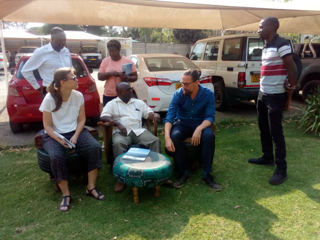 gihubphaseIII's tweet photo. Green Innovator Tafadzwa Mustau explains how he started his innovation of manufacturing  patio and garden furniture using old tyres after being unemployed and this was an opportunity for the visitors from @SwedeninZW DC Section to sample the DIY Crafts https://t.co/Evx3IVKxhI