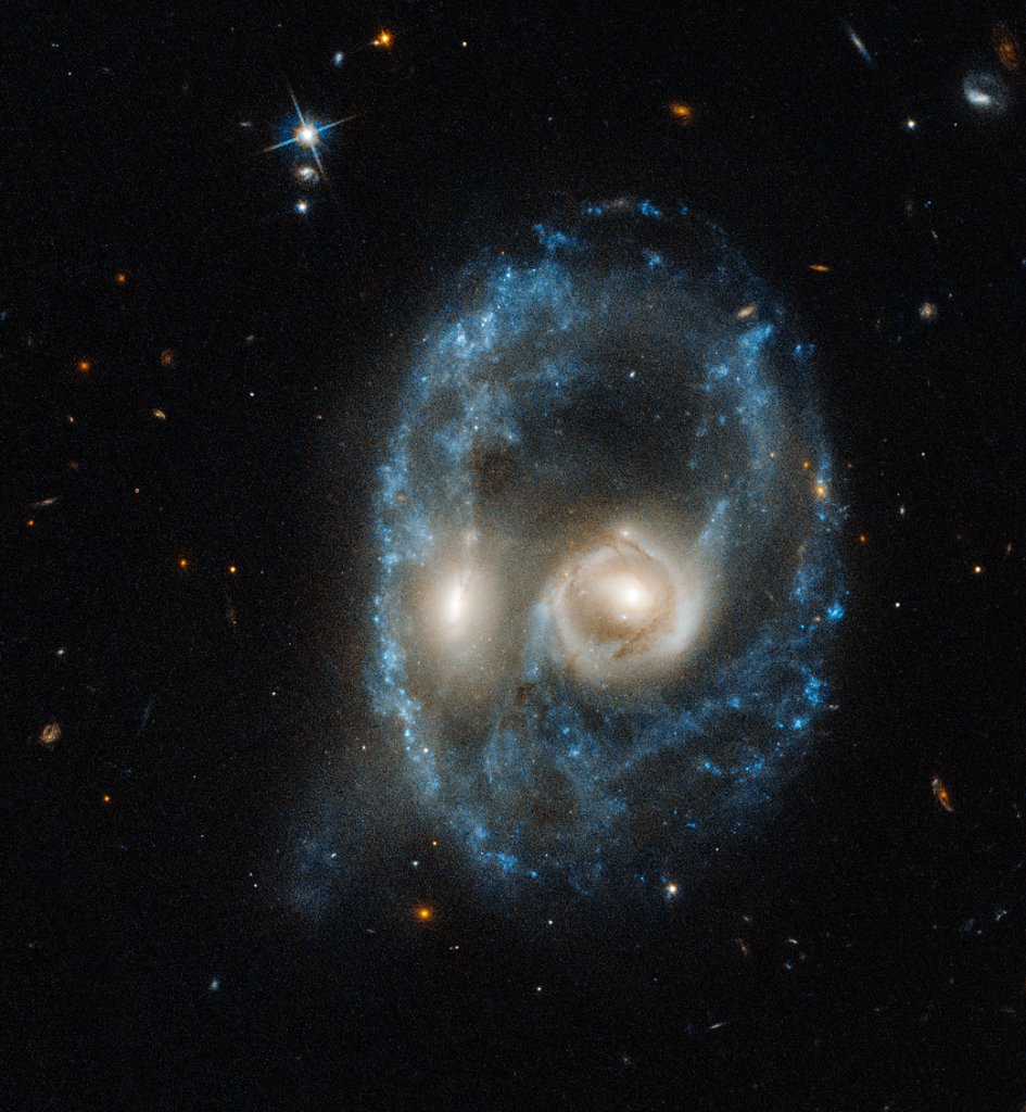 two galaxies appear like a ghostly face