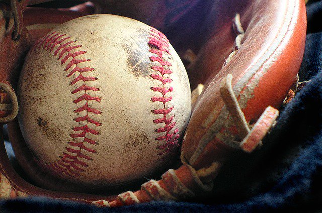 A baseball in a glove.