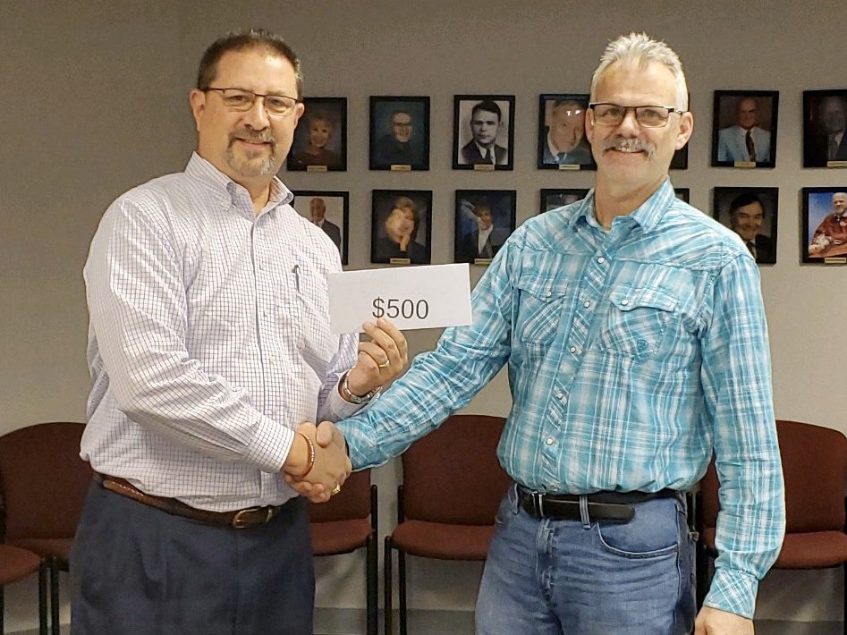 DBFBFoundation's tweet photo. Some of our winners from the 2019 raffle being presented their checks from D-B Football Foundation Vice President Brian Trent. @KCS__Athletics @DBHS_FB https://t.co/j4VYNwOKvi