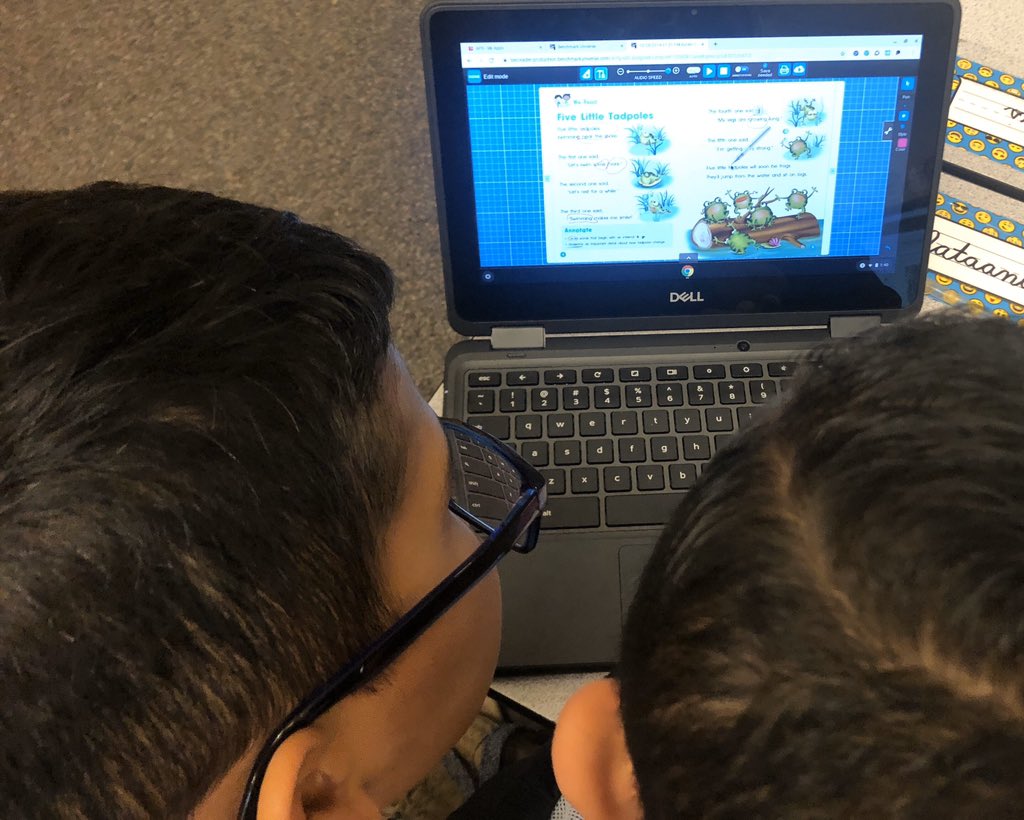 My students working with their 1st grade book buddies to guide them through using the digital tools with Benchmark Advanced.