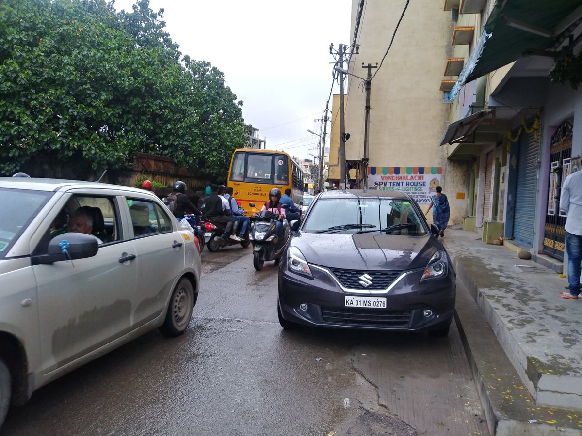velu1122's tweet photo. Today, in Mangammanapalya road (near canara bank ATM) at 7 45am, a car parked on road caused a big choke in that narrow road. People should have common sense before they park... https://t.co/QxLAY08Qi7