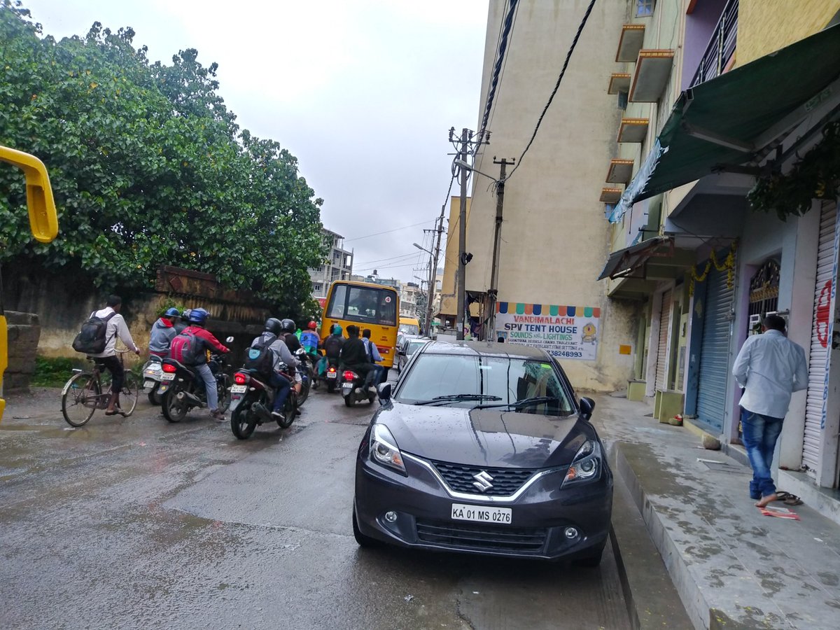 velu1122's tweet photo. Today, in Mangammanapalya road (near canara bank ATM) at 7 45am, a car parked on road caused a big choke in that narrow road. People should have common sense before they park... https://t.co/QxLAY08Qi7