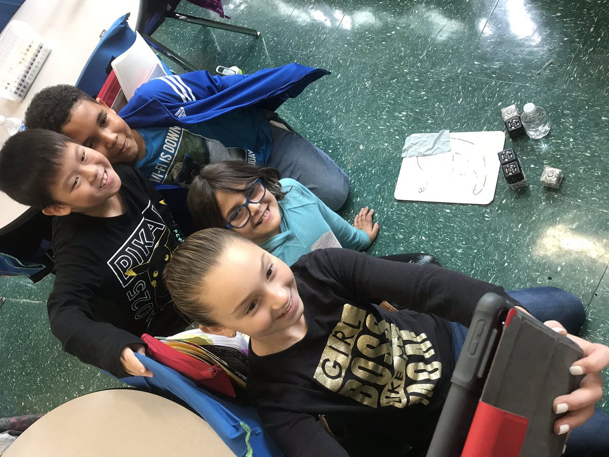 BevilacquaNB's tweet image. Students in Mrs. Kerning’s 4th grade taking a selfie for their Clips video showcasing their robotic whiteboard eraser! #cubelets #modularrobotics @KerningM