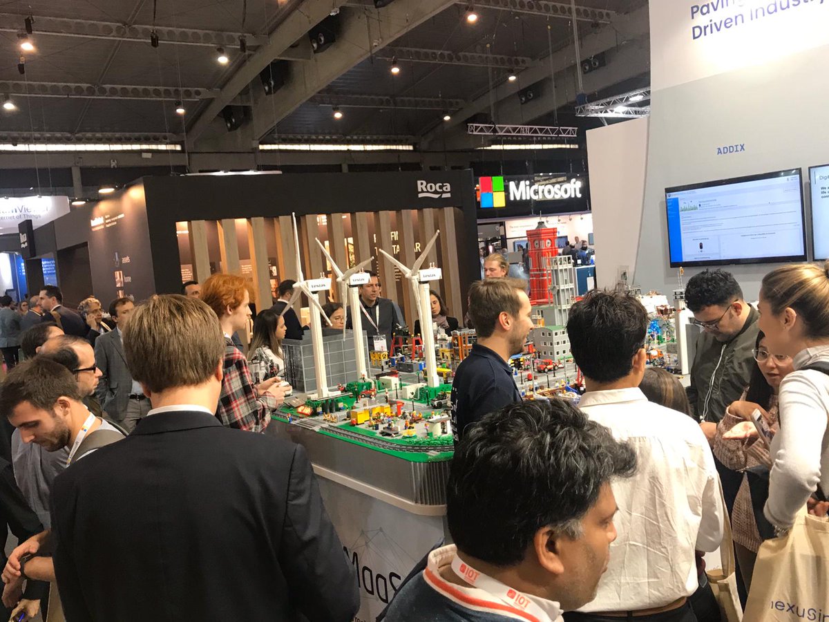 FIWARE's tweet photo. Day #2 at #IOTSWC19 and the FIWARE #SmartCity Model is never short of visitors. 😎 Have you had a chance to see this unique demonstrator up close? Visit the FIWARE Booth at Stand 229. We'd love to tell you more about the idea behind this eye-catching model. #SmartMaaS #FIWARE https://t.co/chuhqSLOfa
