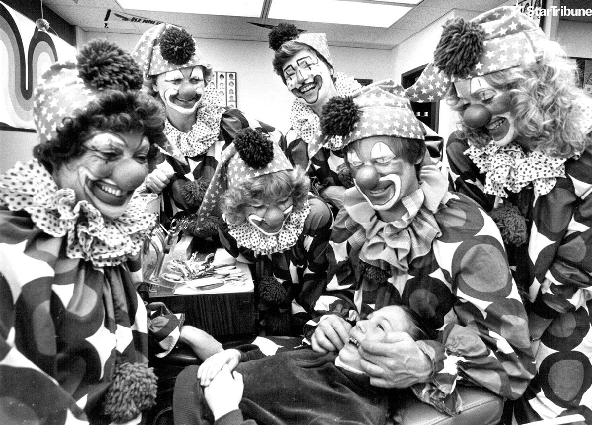Errin Fulgency, 12, visited dentist Dr. Lee Chapman the day after Halloween, 1980 in Richfield, Minnesota. The other clowns in his Southdale Square office were, from left, Idelle Eide, Carol Schlotman, Ruth Nordsletten, Linda Gohde and JoAnn LesSard. (John Croft/<a href="/StarTribune/">The Minnesota Star Tribune</a>)