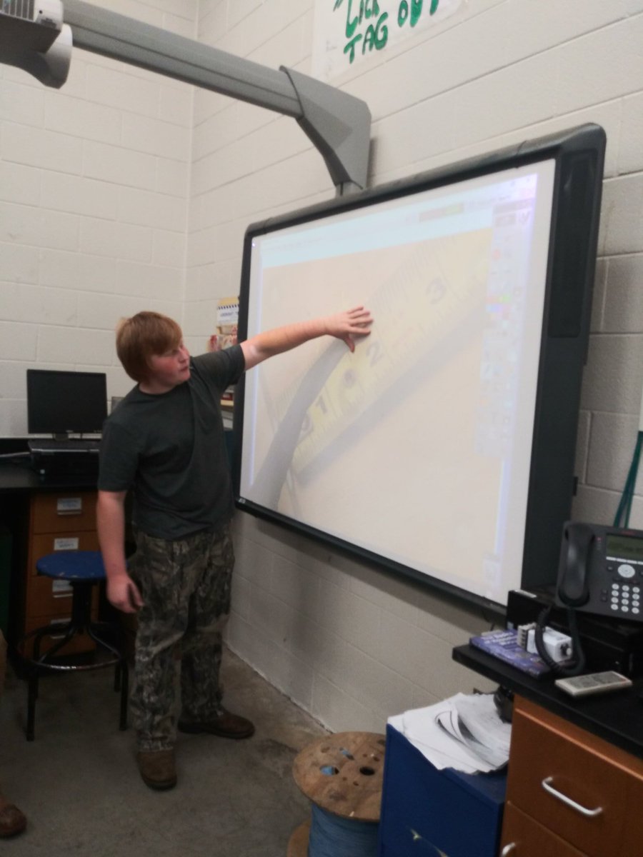 JB_electrician's tweet photo. My 8th graders are learning how to read a tape measure. Jamison had a good understanding on how to read all the marks on the tape so I let him student teach.  Good job! #SOKYECCA https://t.co/LG16ESYi47