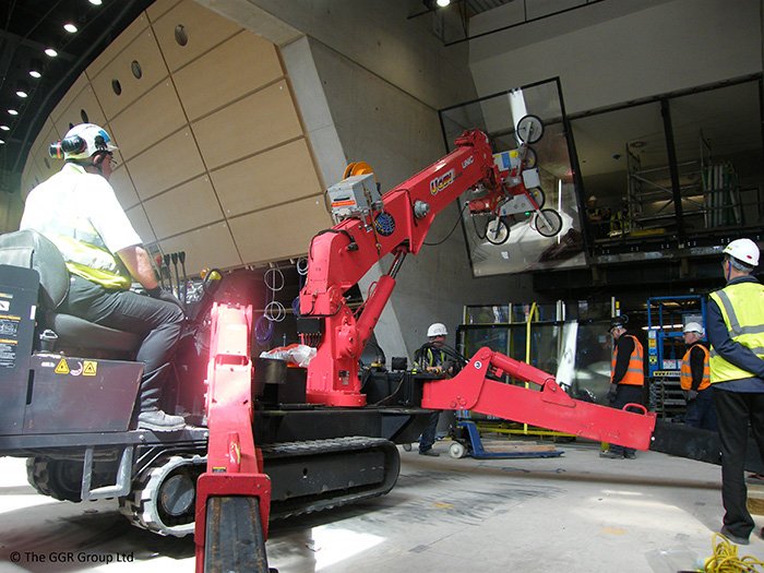 A UNIC URW-506 mini spider crane teamed up with a GL-UMC600 for the installation of angled glass panels inside Glasgow’s SSE Hydro arena #ggrlifting #uniccranes #glazing #installation