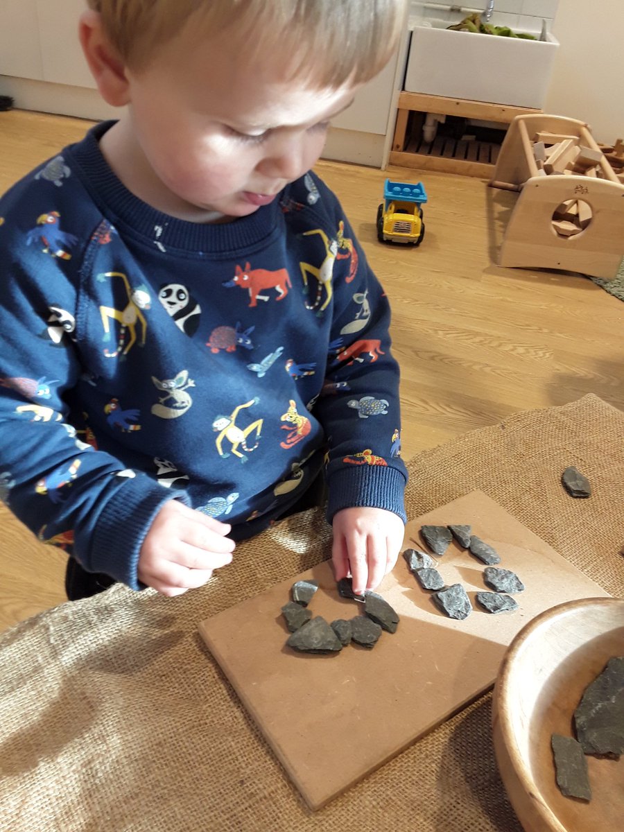 AshbridgeMaxy's tweet photo. #OwlsAtMaxy are engaging in the provocation activity set out for them to explore.They are forming patterns with the stones and critically thinking about different shapes. "I made a circle" "I used lots of stones" #CharacteristicsOfEffectiveLearning #ShapeSpaceMeasure #EYFS https://t.co/MAVa4FtWSV