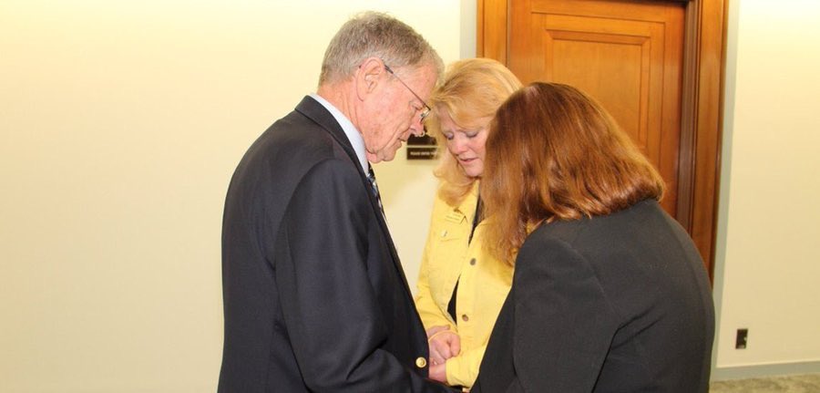 EndTheOffset's tweet photo. @JimInhofe Prayers are wonderful and you’re actually in a position to answer prayers for military surviving spouses. Here you are praying with two in April when you vowed to repeal the widow’s tax. Yesterday you broke your vow and left the repeal out of the NDAA. Disgraceful! #AxeWidowsTax https://t.co/EX7rSbRwnr