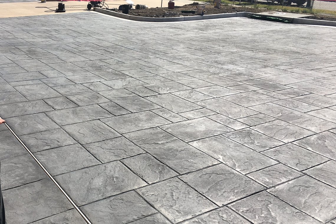 TheHardscaper's tweet photo. The Schwab - Phase 3 is a beautiful in-progress project located in LoneTree. Collaborating with Mortenson, Schwab's designers and Davis Architects, we decided to use Bomanite Imprinted concrete at the main entry and MicroTop - ST on preexisting walls. https://t.co/JhOvcE00Yv