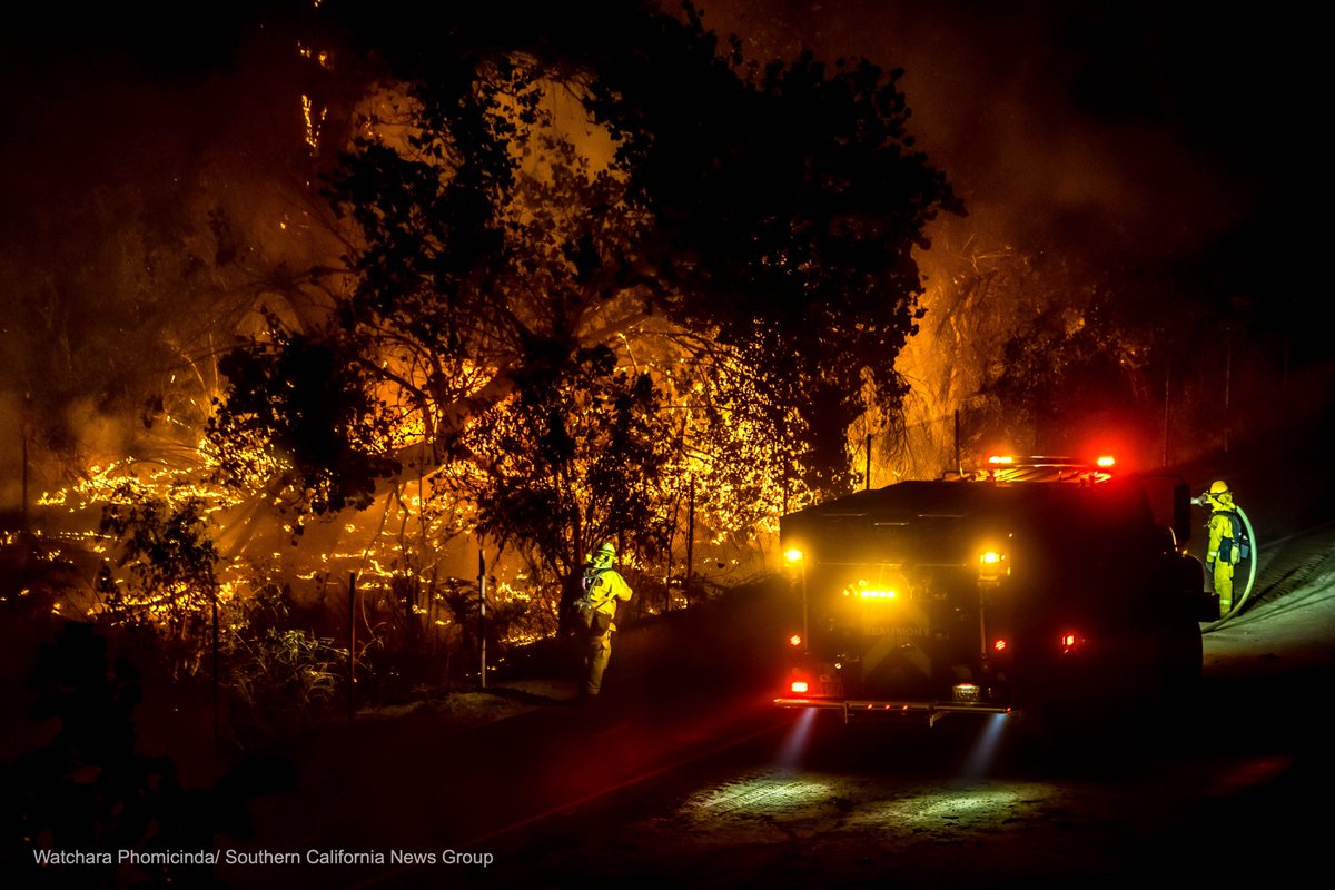 Firefighters battle to contain the #46thFire burning in the Santa Ana River bottom near Martha McLean-anza Narrows Park in Riverside.