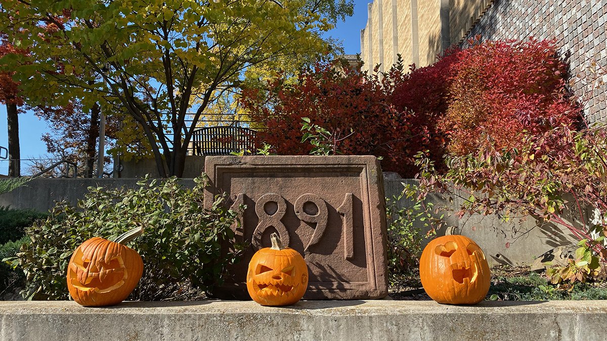 Fall scene featuring 3 jack-o'-lanterns on UW Law's Boerner Plaza