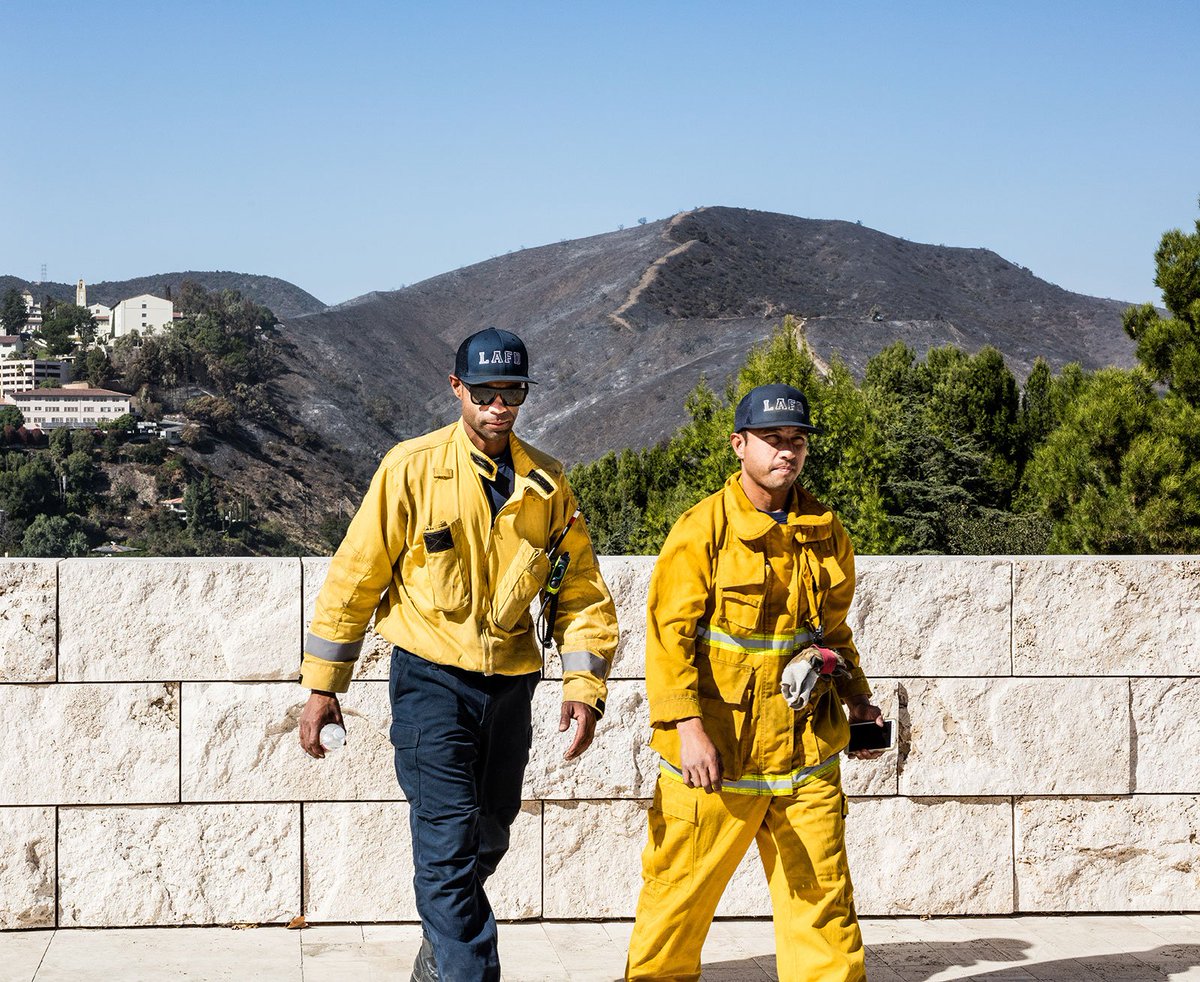 Two members of the Los Angeles Fire Department on the job at the Getty Center attending to the Getty Fire.