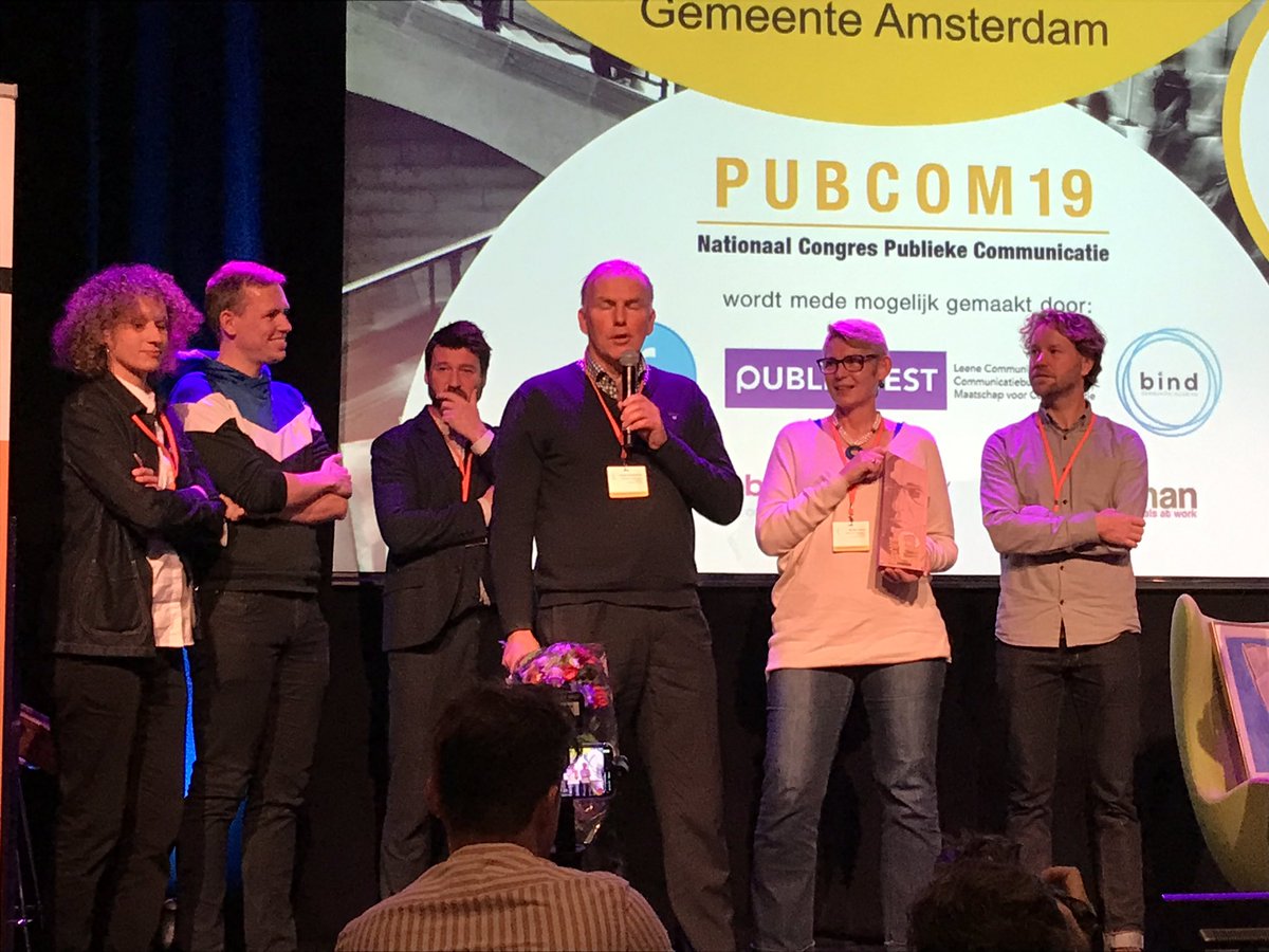 R_Hoogstraten's tweet photo. De winnaars van de Galjaardprijs 2019: gemeente Amsterdam met ‘We live here. Hoe je De Wallen samen met bewoners weer woonwijk kunt laten zijn. Terechte winnaar en mooi dat bewoners zelf de prijs in ontvangst nemen #pubcom19 https://t.co/XKOLstd2DU