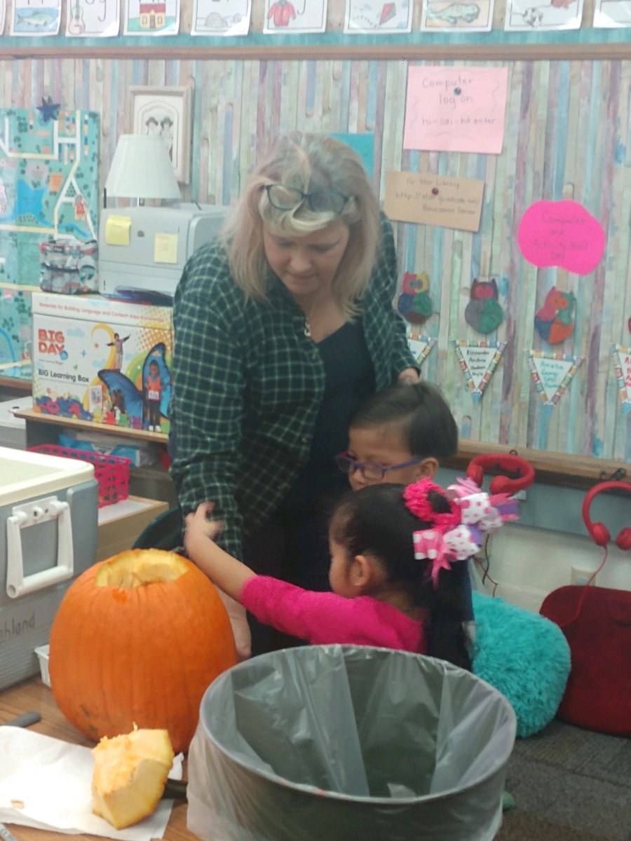 Feeling pumpkin guts in PreK! The general thought was...ewwwww!!
