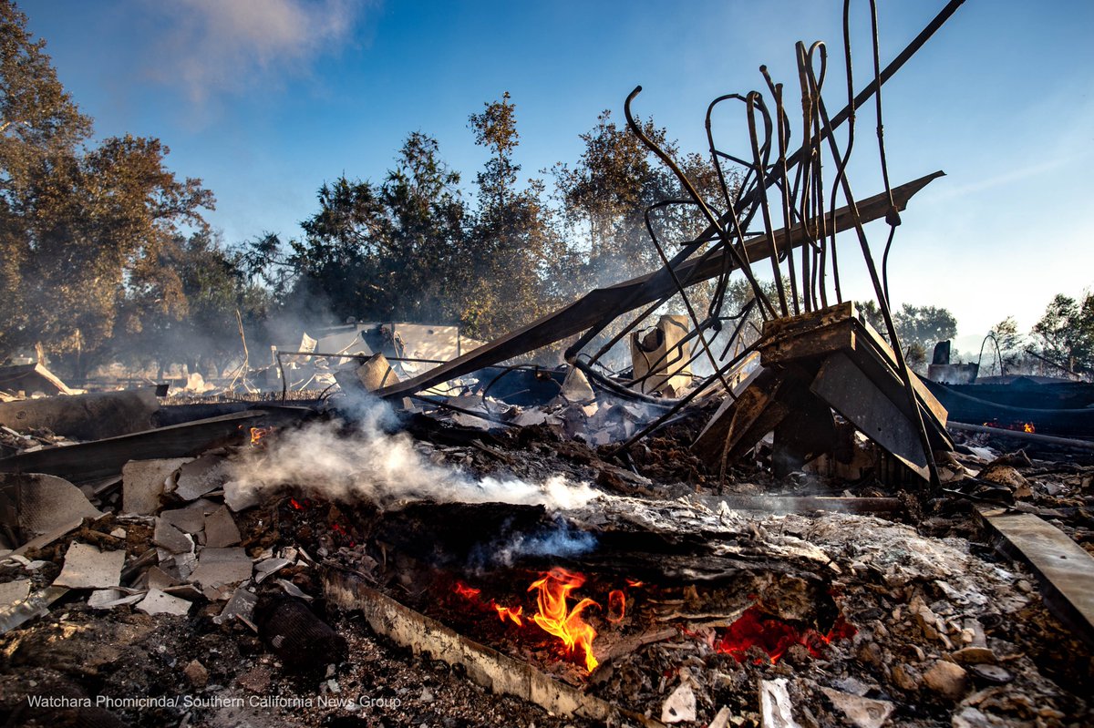 A CalFire firefighter mops up hot spots at the Louis Robidoux Nature Center in Riverside as the #46thFire swept the area.