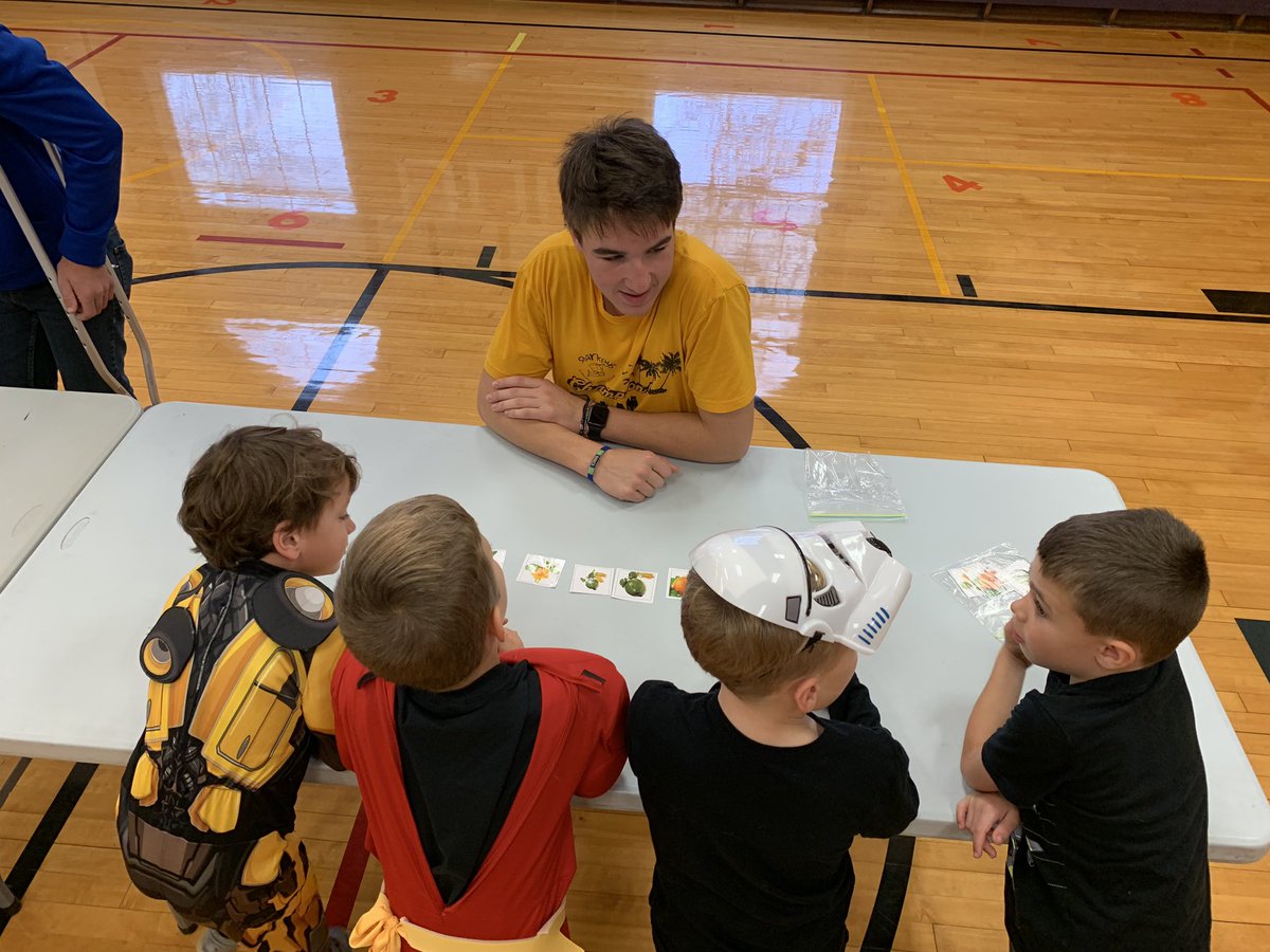 Mrs_CEaton's tweet photo. I had the pleasure of watching FFA members teach a mini lesson to Kindergarteners today about the  plant life cycle and each kid made a living necklace to bring home. These high school students did a great job engaging their young friends #MarcellusCSD @MarcellusAgEd https://t.co/6AH7dCSEnE