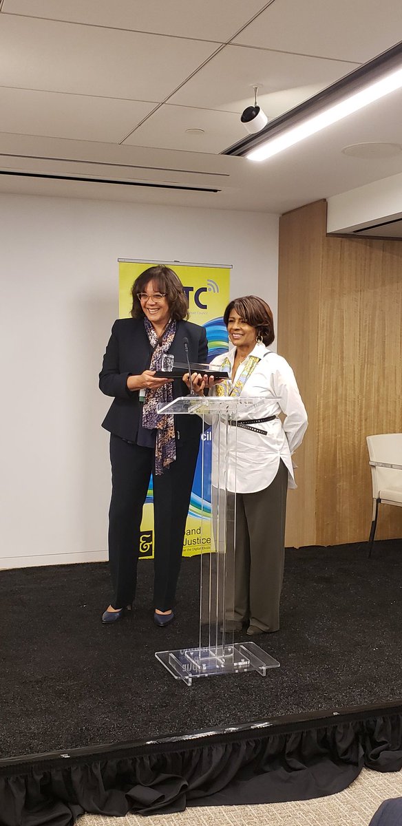 mmtconline's tweet photo. MMTC CEO @MauritaColey presents the Excellence in Pro Bono Services Award to #AshleyHager @tstweets. #SharieBrown @tstweets accepted the award on behalf of #AshleyHager. #MMTC19 https://t.co/Sx0QlqnY3A