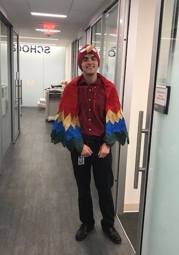 uconnmba's tweet photo. Angry bird? No, it's our Program Administrator, Ryan Baldassario, dressed up for Halloween as a parrot! https://t.co/62iQaLd4Ki