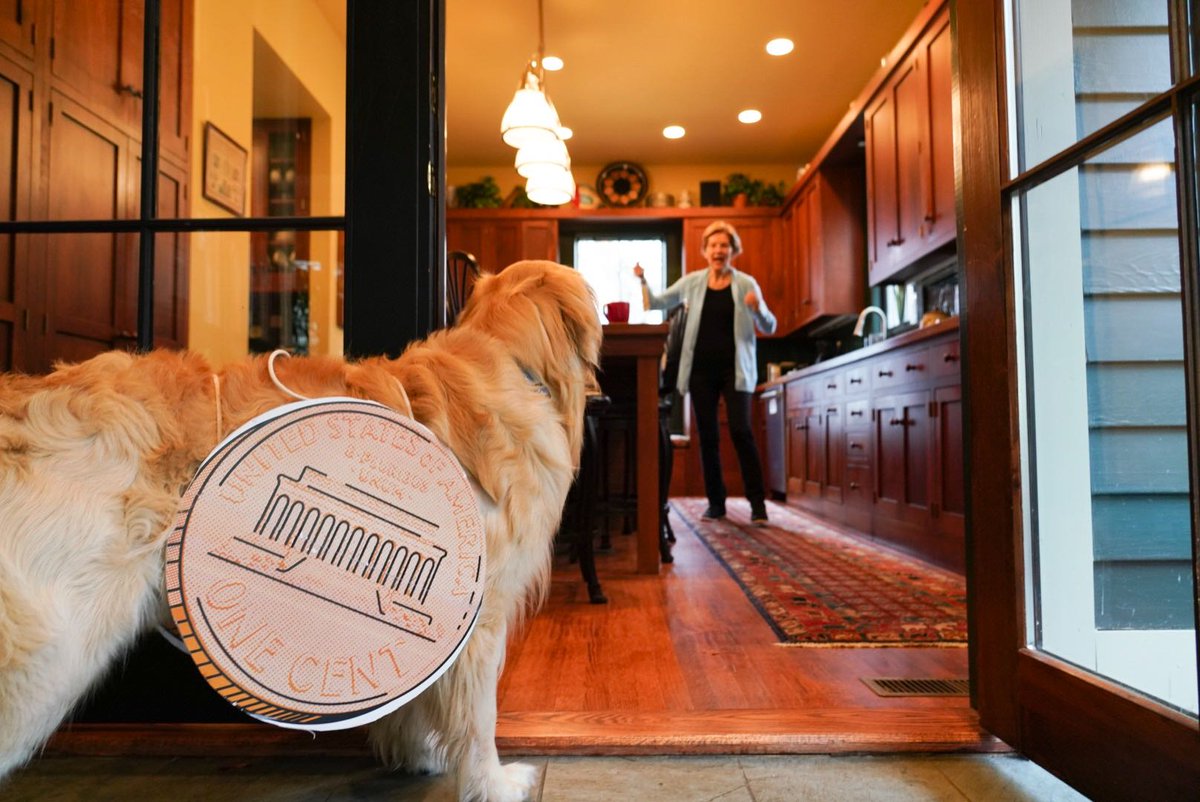 Elizabeth Warren cheers at Bailey's Two-Cent Wealth Tax costume.