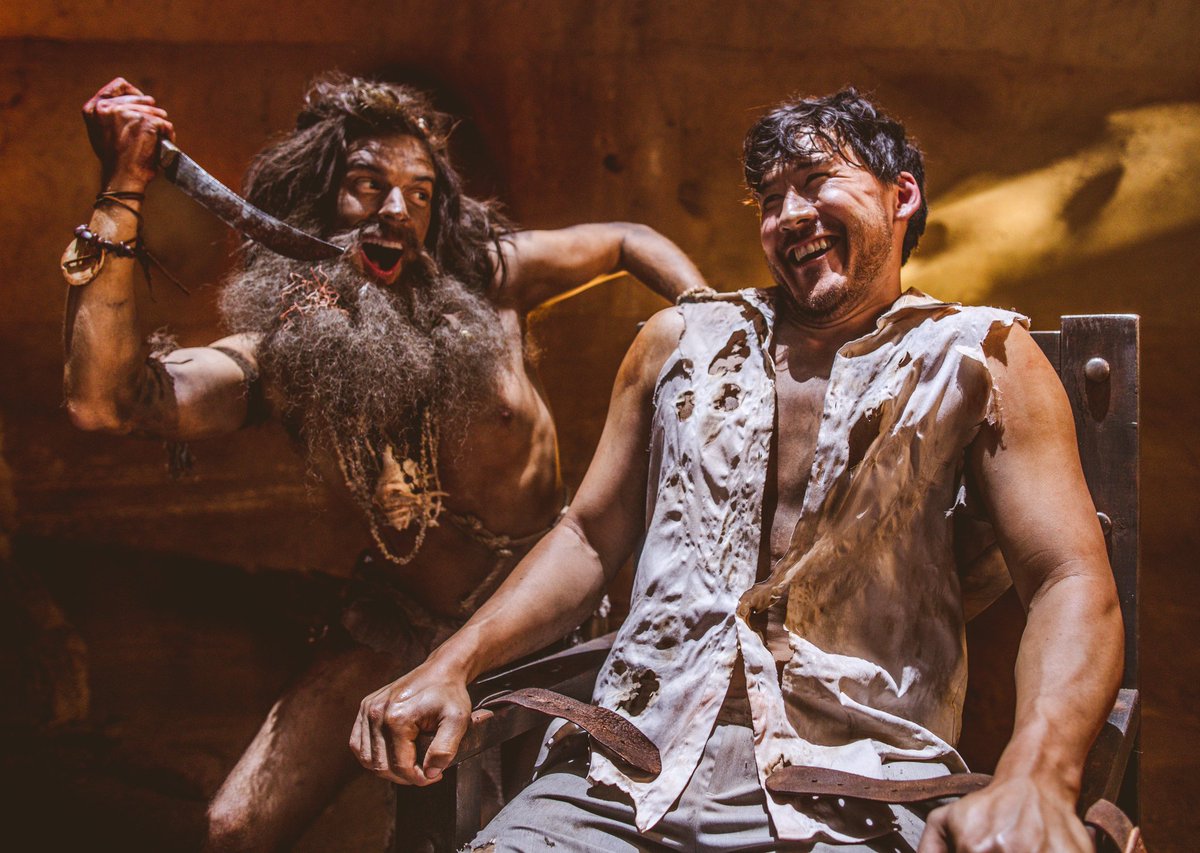 MatPat as crazy cave man threatening to stab Markiplier, but everyone smiling and laughing