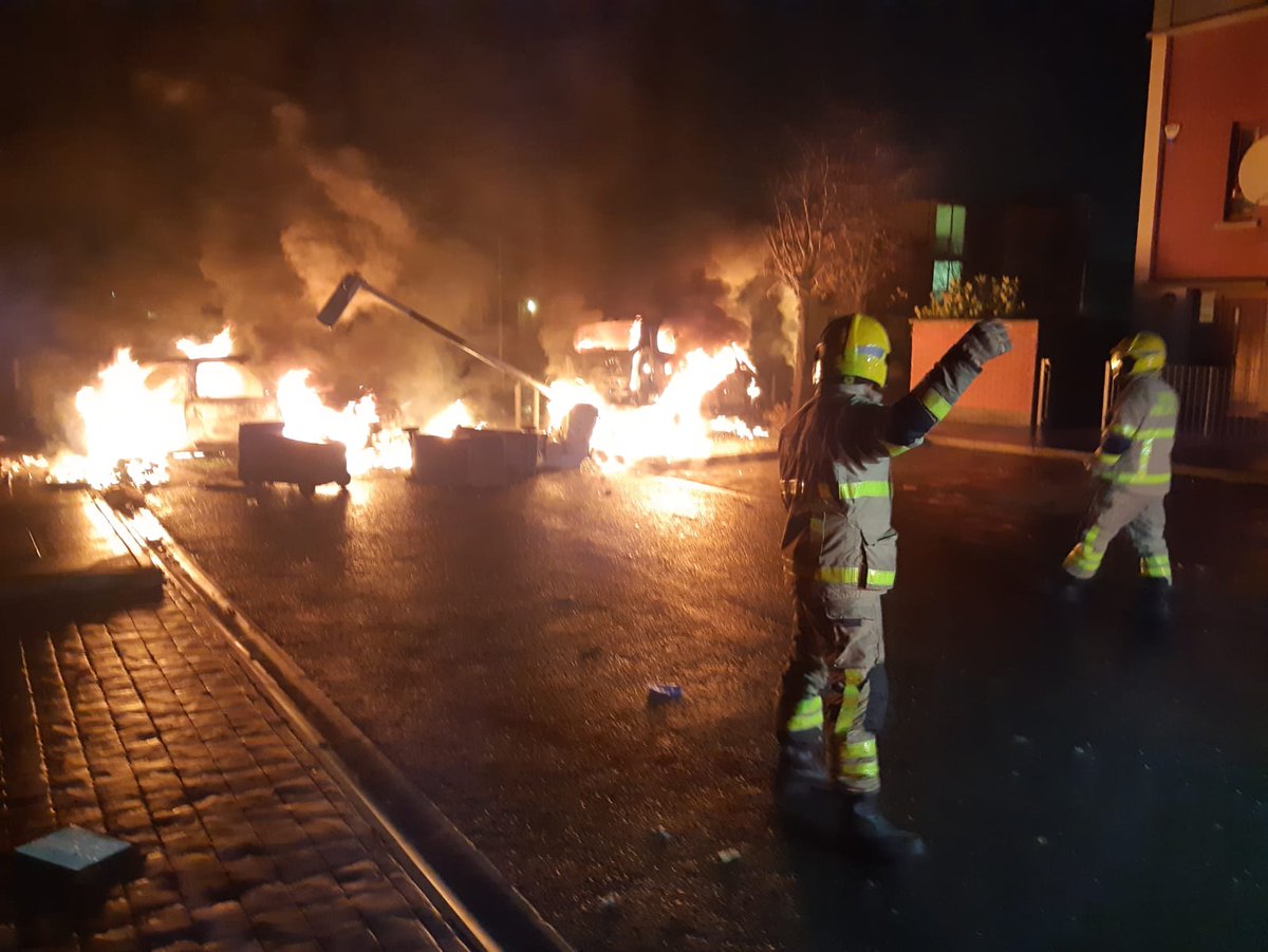 DubFireBrigade's tweet photo. 2 cars alight and a downed lamp post blocking the entrance to an estate in Fortunestown tonight. Fire crews from Tallaght fire station dealing with the incident #Dublin #fire #DFBLive #Halloween #halloween2019 https://t.co/whphtch4n4