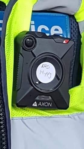 redblacknotes's tweet image. Photos of @VictoriaPolice officer at blockade IMARC, taken yesterday, who has covered his bodycam with a sticker that reads "EAD Hippy". #BlockadeIMARC Source: m.facebook.com/story.php?stor…
