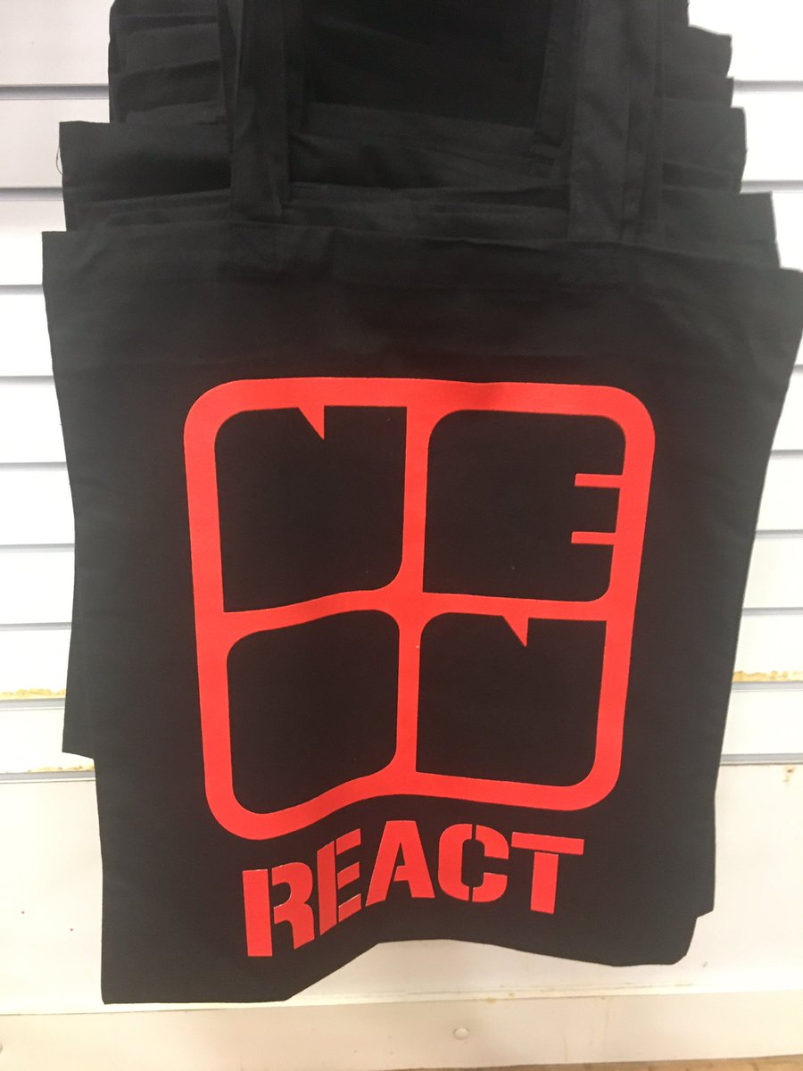 weareneon's tweet photo. We have merch! T-shirts are £7 and tote bags are a fiver. Cash only. Come find us in the Wellgate Centre! #NEoN2019 #neonreact https://t.co/00ToEyqVcF