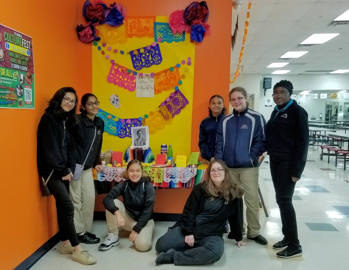sandration33's tweet photo. The Chesapeake Science Point Multicultural Club in front of the "Ofrenda" for Dia de Muertos. #csp #chesapeakesciencepoint #diademuertos #cspmulticulturalclub #clf_pr #aacps https://t.co/bfTYRUVV1h