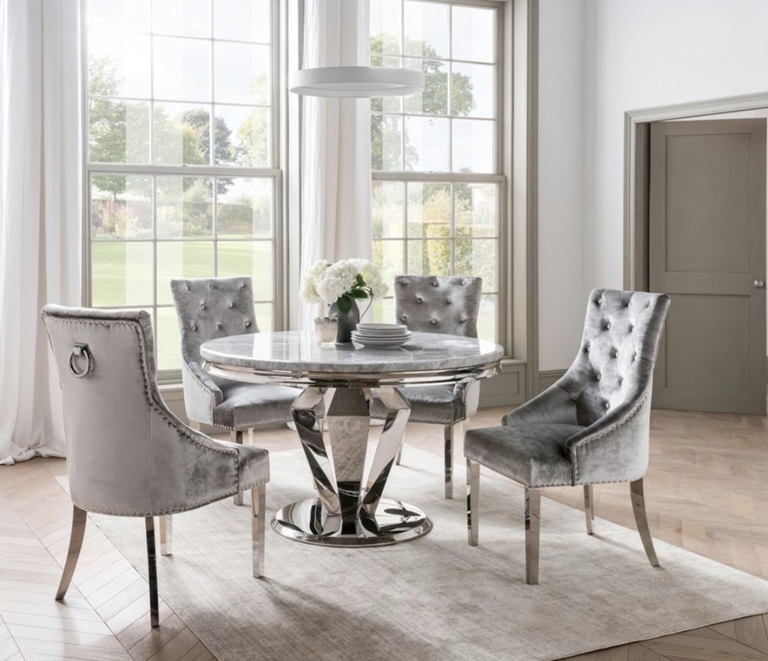 The Arran dining and occasional range is a stylish &amp; contemporary collection with billowed stainless steel legs and grey marble tops.

The range includes dining tables, console &amp; lamp tables.