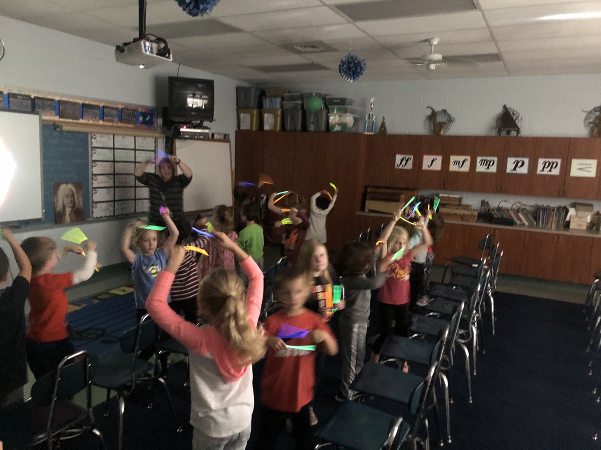 CoachAdams2010's tweet photo. @TEAMDISNEYPod K students working on rhythm standards, steady beat, crossing the midline, and patterns with ghostbusters song.  Cross curricular lesson between PE and Music.  Thanks @TrishTtaff for the creative collaboration.  #glowsticksrock @SPS_PhysEd. https://t.co/llOsbKsEoC