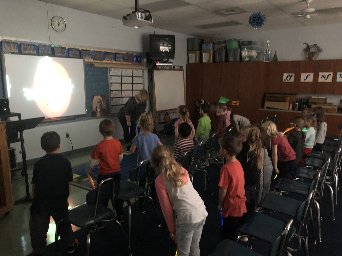 CoachAdams2010's tweet photo. @TEAMDISNEYPod K students working on rhythm standards, steady beat, crossing the midline, and patterns with ghostbusters song.  Cross curricular lesson between PE and Music.  Thanks @TrishTtaff for the creative collaboration.  #glowsticksrock @SPS_PhysEd. https://t.co/llOsbKsEoC