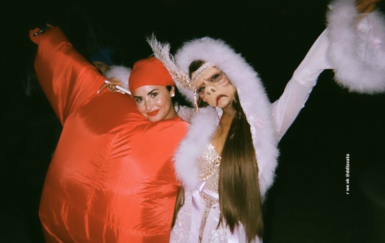 Pop Base on X Ariana Grande Demi Lovato pose for photo in their Halloween costumes. https t cKkwCX4JWW X