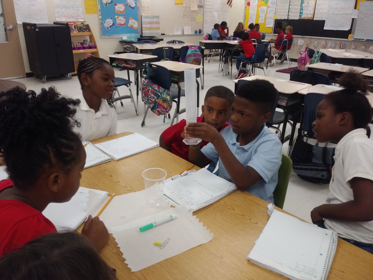 Can you say engagement? Using water displacement to measure volume. Great scientists!