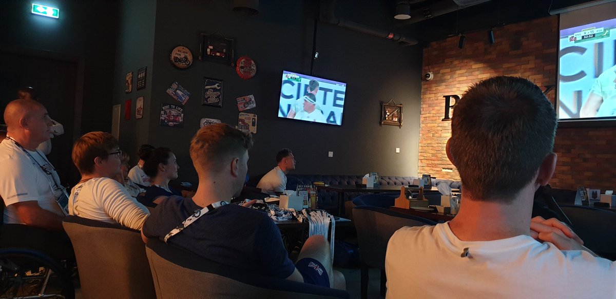 JenniBanksGB's tweet photo. Two South African supporters in a bar full of English supporters, but only two people are smiling and the remainder are starting to lose interest! #RWCFinal #ENG12-25RSA #dubai2019 https://t.co/YFZ0OKVxSt