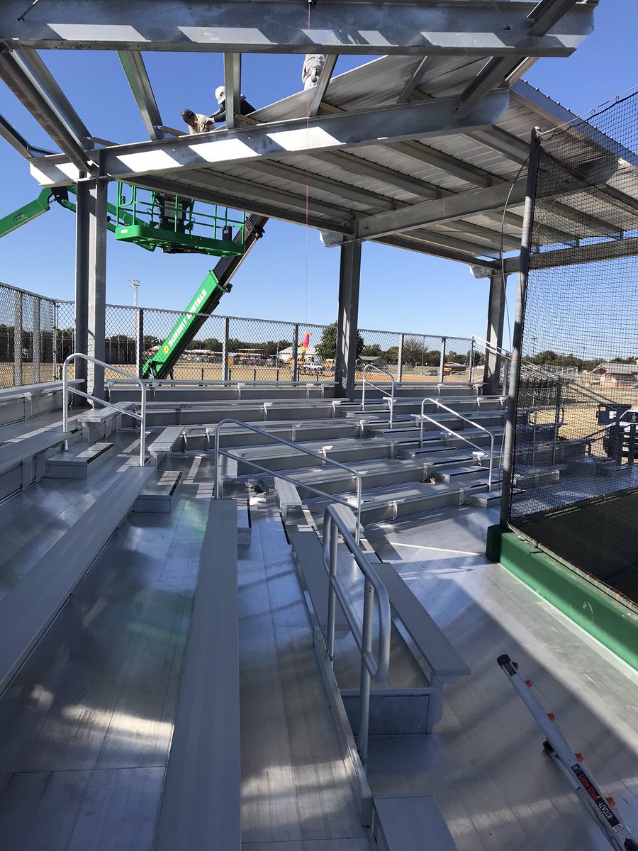 BISDFacilityDir's tweet photo. Baseball bleachers metal roof going on! @BradOwenBISD @ChaplinTylor @burkburnetths @MorrisVance https://t.co/F1UY0P2zUn