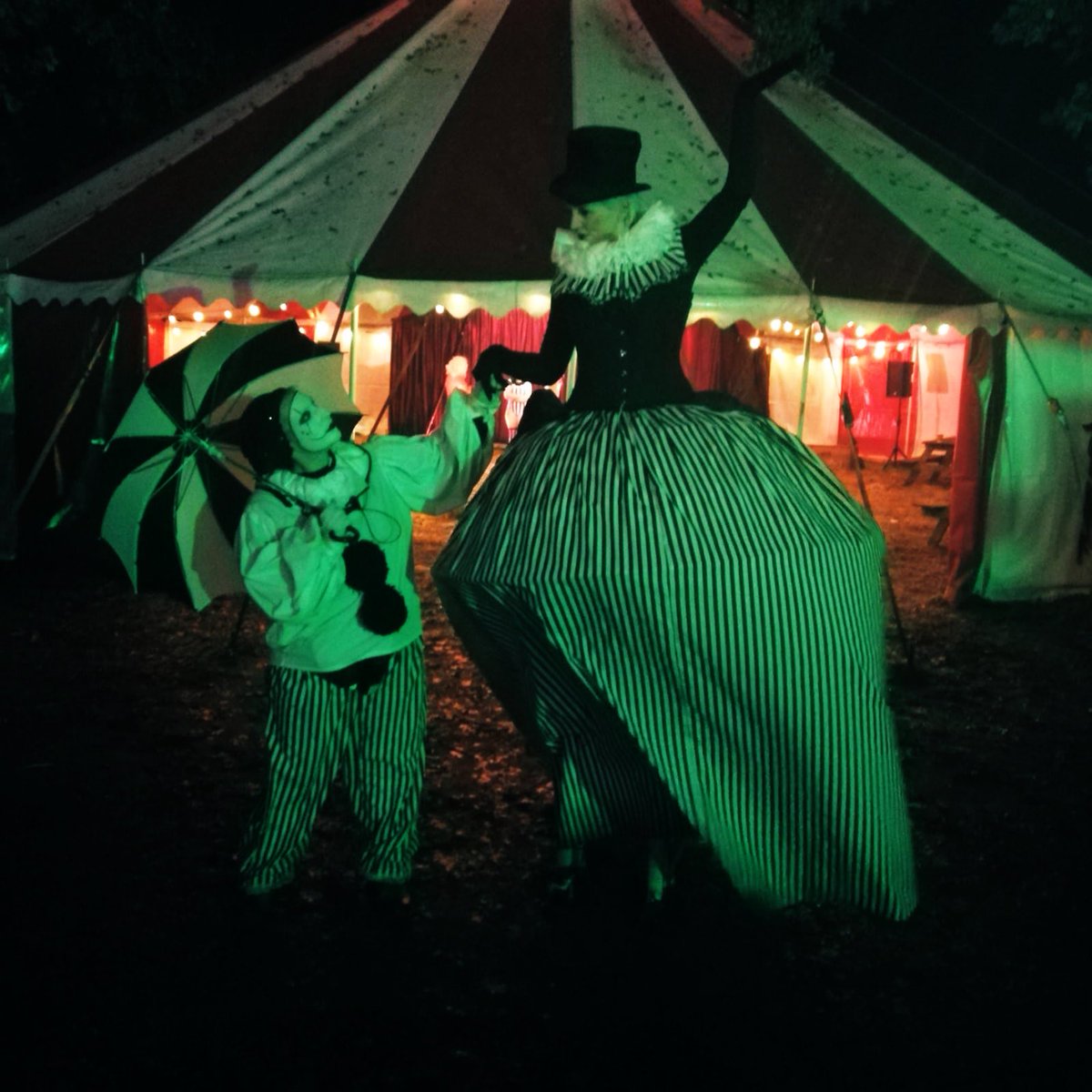 KentwellPlayers's tweet photo. Last night of @Scaresville tonight. It has been a crazy wonderful month working with some wonderful open inventive people both featured in this photo and otherwise. #kentwell #halloween #pierrot #stilts #unfairground #circus #performer #character #actor #firstperson #monochrome https://t.co/25XJrqu668