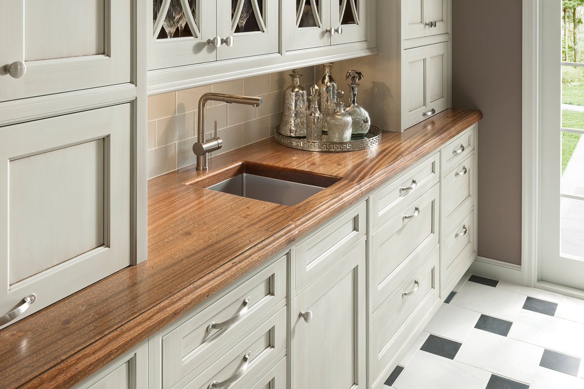 Wood counters for kitchens offer many advantages. Grothouse wood counters can be constructed any size in one piece, and eliminates the worry of an unsightly seam common with countertops constructed of granite or stone slabs. #grothousecounters #woodcountertops #kitchendesign
