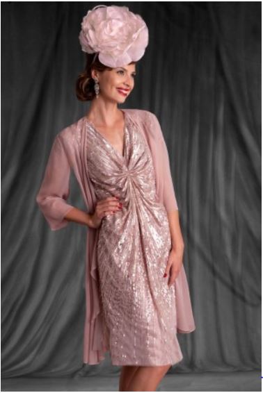 A gorgeous '20s inspired dress from #GillHarvey - this beautiful pink, beaded look is sure to make you stand out! Perfect for a #Christmas wedding. #MotherOfTheBride #MotherOfTheGroom #GoodbuyJourdan