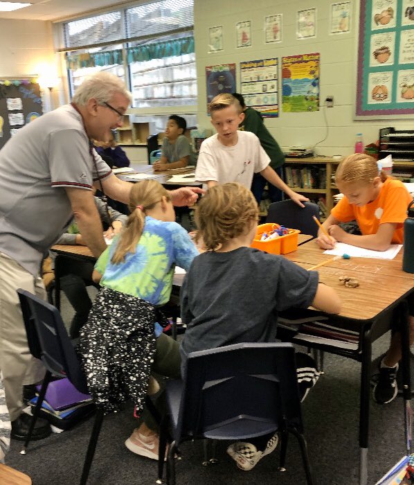 SnazzyTieGuy's tweet photo. The things we do for math!! Stopping by @meg_morris1 5th Grade class on Halloween, I accepted her challenge to dig out my destiny coin from a box of Maggots — which sent me on to solve a complex math problem with these cool @CRESCubs students! 🎃 https://t.co/Gq83YADmg4